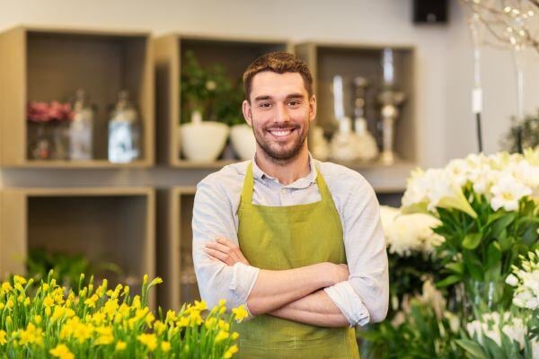 Grocery store florist smiling