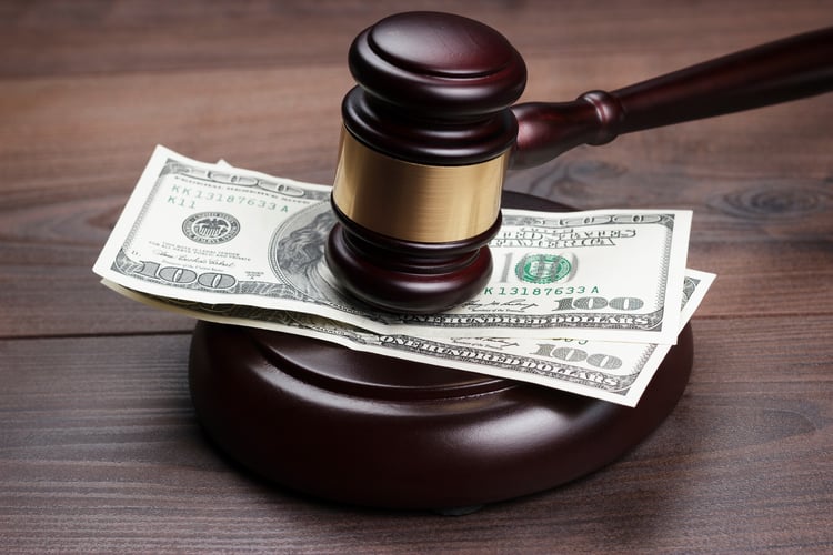 judge gavel and money on brown wooden table.jpg