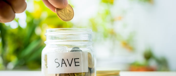 save money coin jar hand.jpg